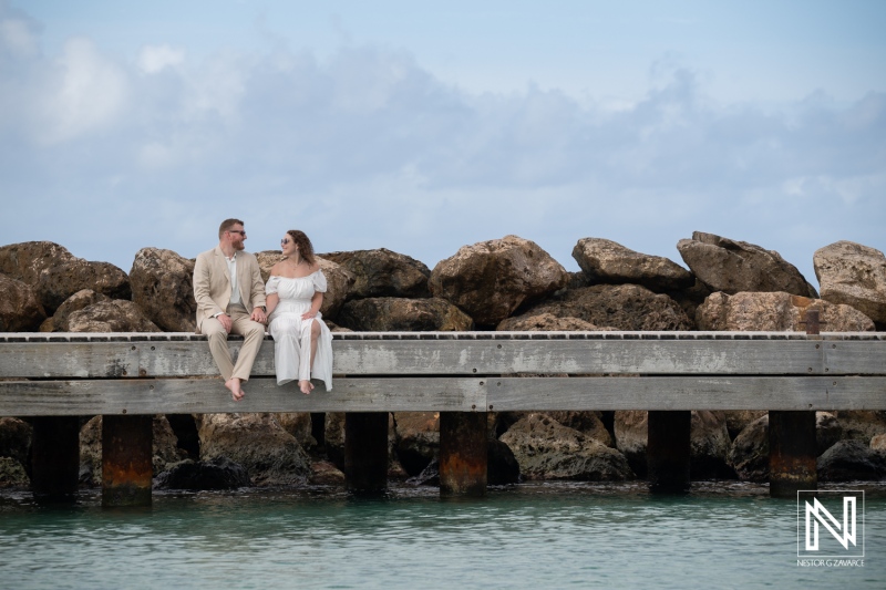 Newlyweds Seated on the Pier