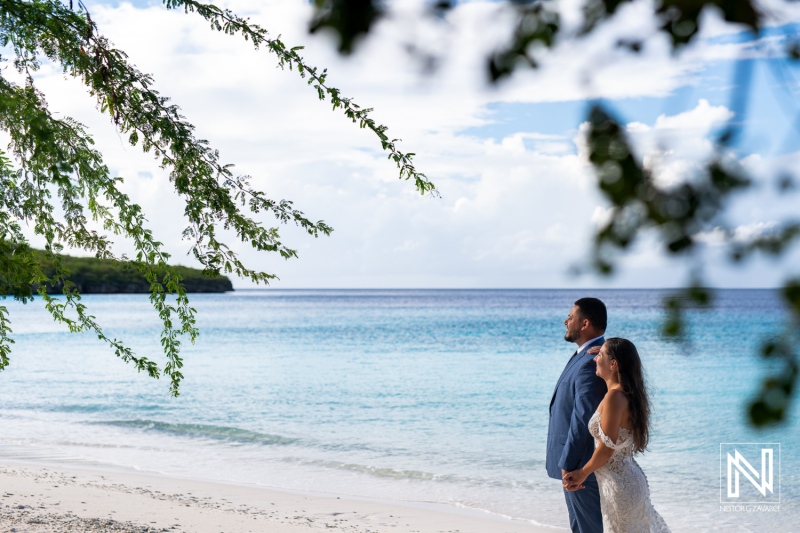 Couple embraces serenity at the beach in Curacao during a Trash the Dress session