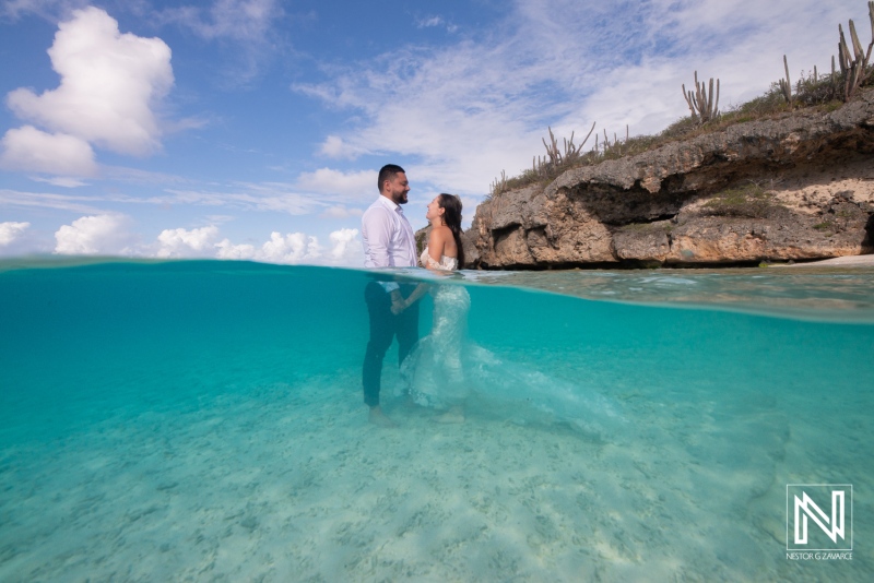 Celebrating love in the clear Caribbean waters of Curacao during a Trash the Dress session