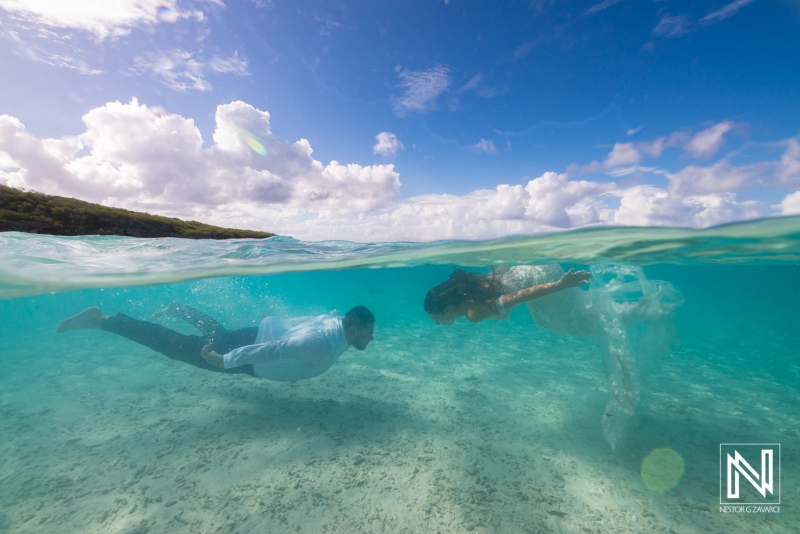 Captivating underwater moment during a Trash the Dress session in Curacao showcasing love and creativity in a stunning tropical setting