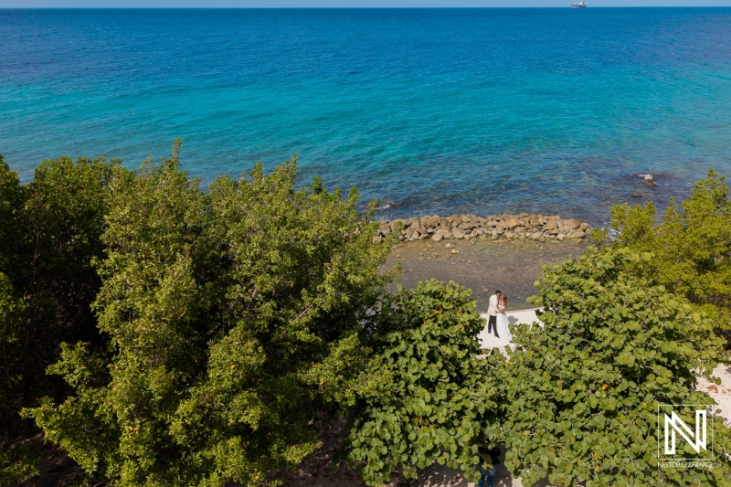 Celebrating love with a memorable trash the dress session at the stunning Curacao coastline during bright daylight