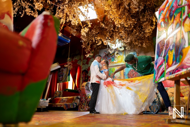 Creative trash the dress session in Curacao highlights vibrant colors and joyful post-wedding celebration
