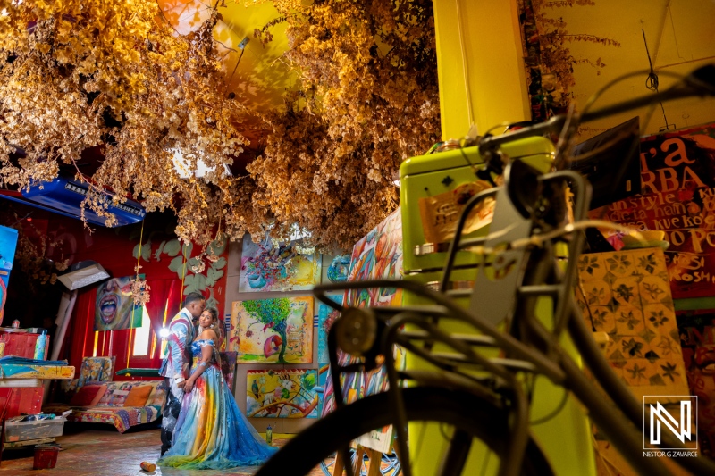 Trash the dress session in colorful Curacao showcasing the beauty of a post-wedding photoshoot in a vibrant artistic setting