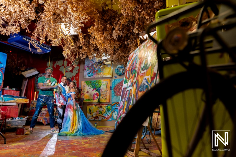 Post-wedding Trash the Dress session in vibrant Curacao art studio captures joyful moments and creative expressions