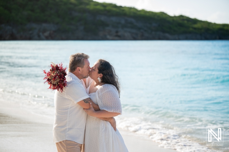 Couple enjoys a trash the dress photoshoot at Cas Abao Beach in Curacao during a sunny day by the water