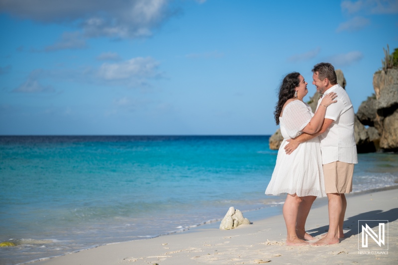 Couple enjoys a trash the dress photoshoot at Cas Abao Beach in Curacao on a warm sunny day