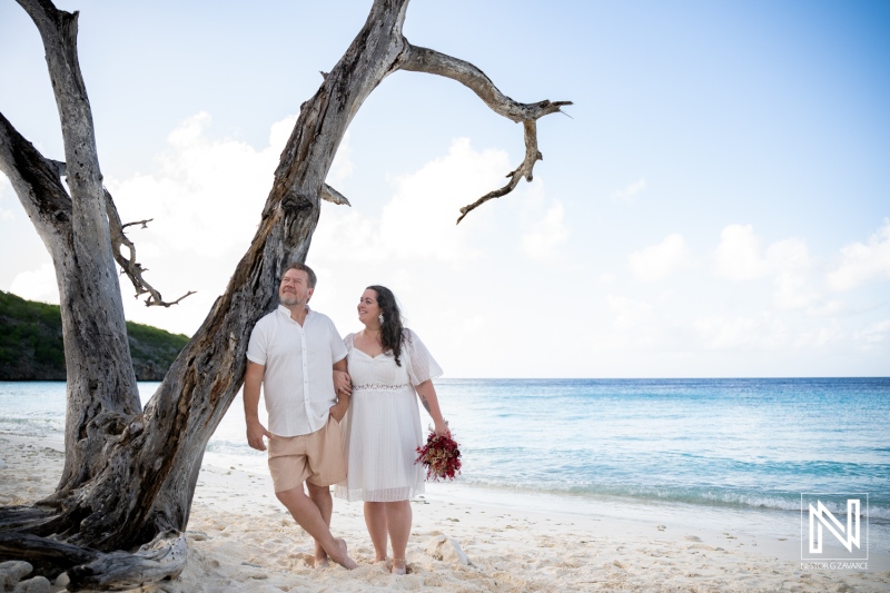 Couple enjoys trash the dress photoshoot at Cas Abao Beach in Curacao during a sunny day