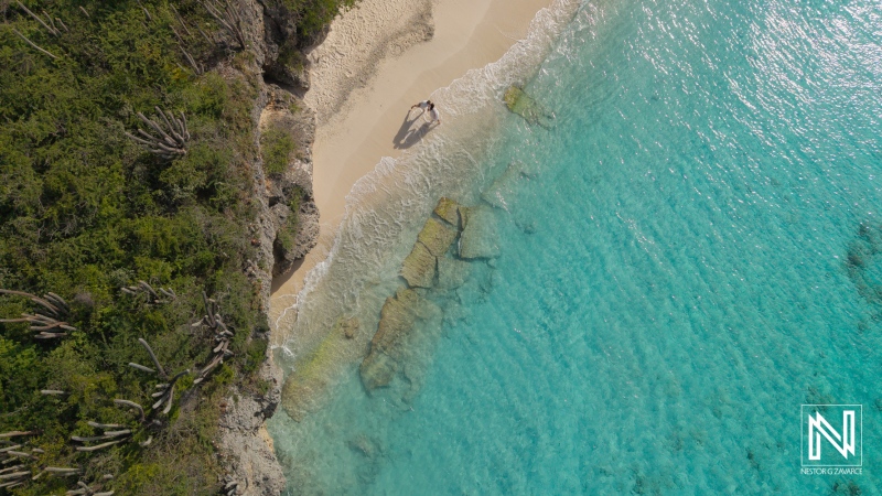 Trash the dress photoshoot at Cas Abao Beach in Curacao captures joyful moments by the water