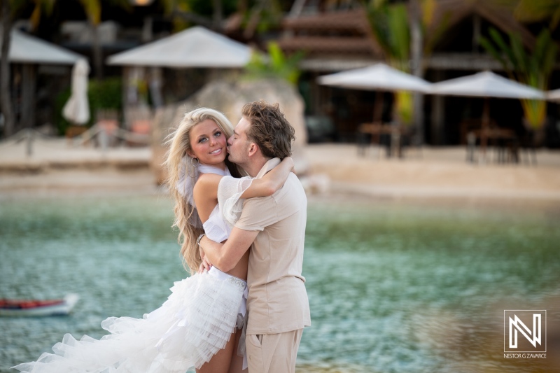 Beautiful Trash the Dress session at Baoase Luxury Resort in Curacao during sunset with joyful couple by the water
