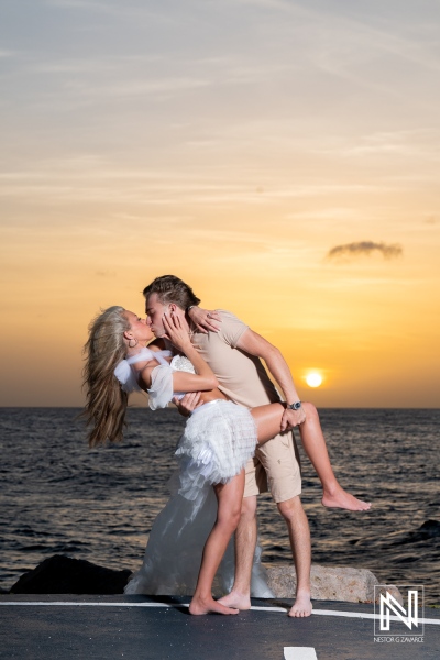 Couple enjoys trash the dress session at Baoase Luxury Resort in Curacao during sunset
