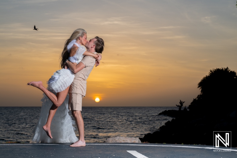 Couple enjoys a Trash the Dress session at Baoase Luxury Resort in Curacao during sunset near the ocean