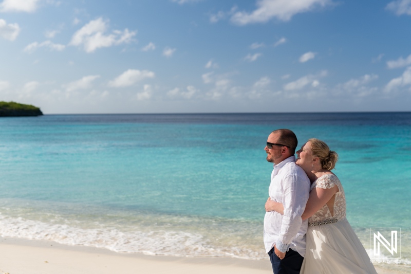 Couple celebrates love during Trash the Dress session at Cas Abao Beach in Curacao with stunning turquoise waters in the background