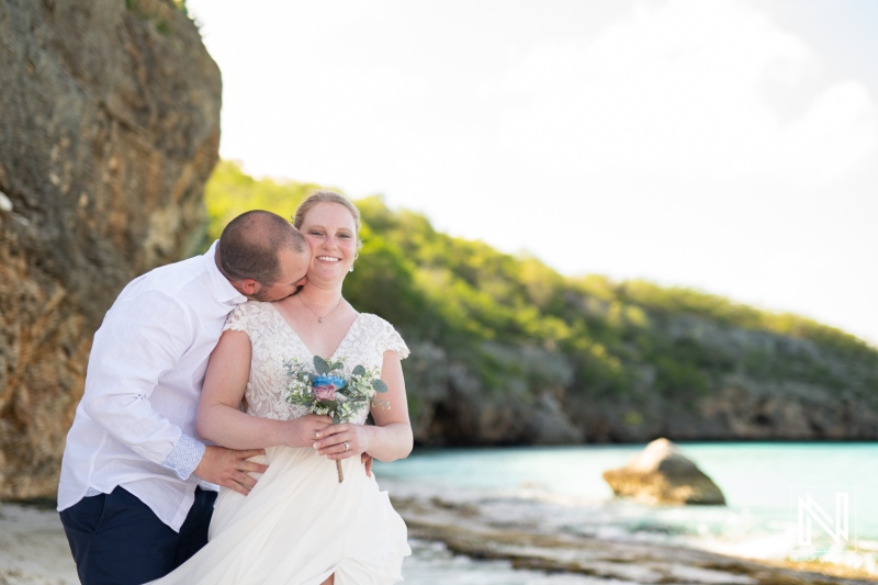 Couple celebrates love with an intimate trash the dress session at Cas Abao Beach in Curacao during a sunny day