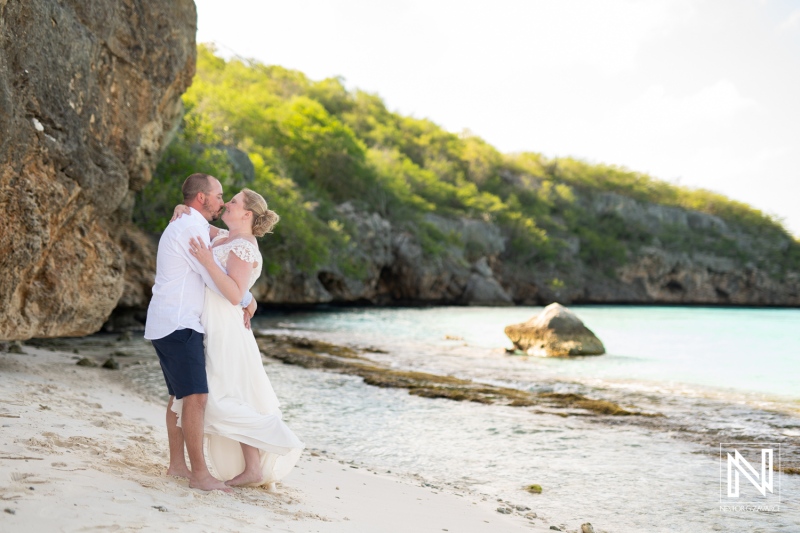 Couple enjoys a romantic moment during Trash the Dress session at Cas Abao Beach in Curacao on a sunny day