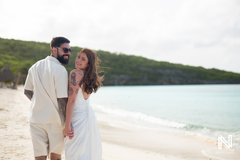 Couple enjoys a romantic trash the dress session at Cas Abao Beach in Curacao on a warm sunny day