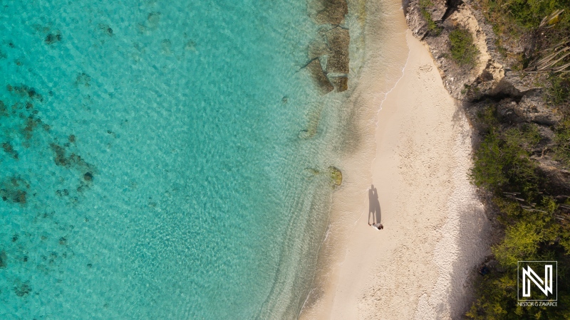 Experience a romantic trash the dress moment at Cas Abao Beach in Curacao with stunning turquoise waters