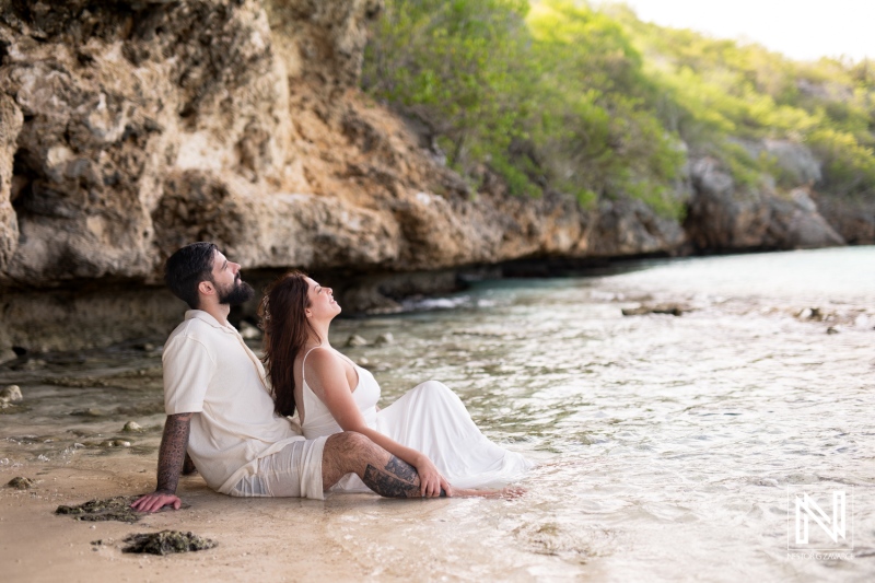 Couple enjoys romantic moment at Cas Abao Beach during Trash the Dress session in Curacao at sunset