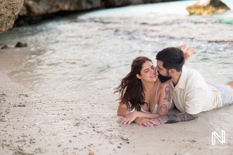 Couple enjoys a romantic moment at Cas Abao Beach during a Trash the Dress session in Curacao