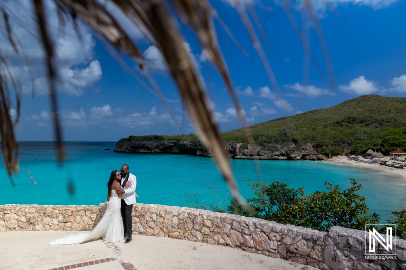 Trash the dress photoshoot takes place in Curacao near the beach with a couple enjoying their moment