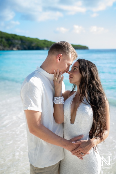 Couple enjoys a Trash the Dress photoshoot at Cas Abao Beach in Curacao on a sunny day