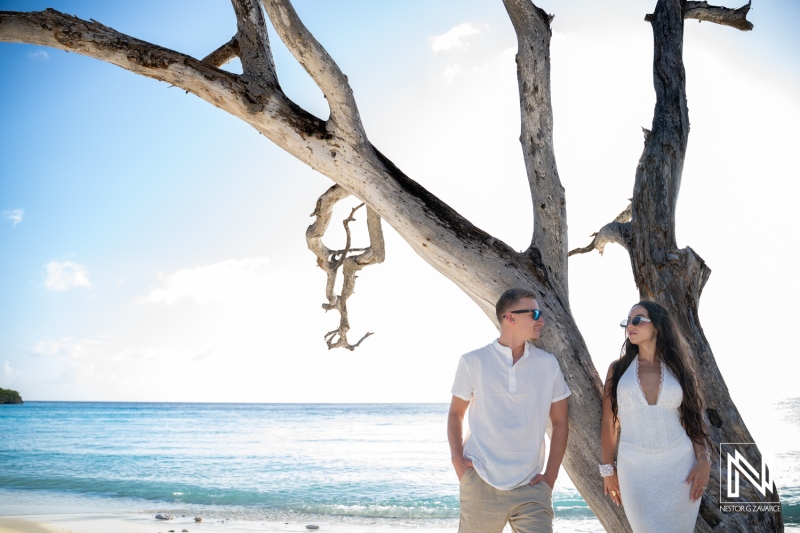 Couple enjoys trash the dress photoshoot at Cas Abao Beach during sunny day in Curacao