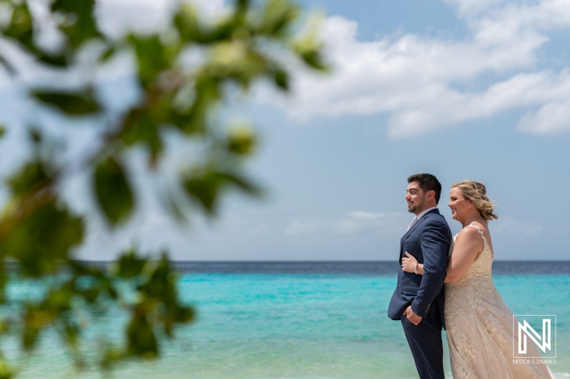 Couple celebrates love in stunning Trash the Dress session along the beautiful shores of Curacao during bright daylight