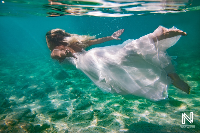 Diving underwater in Curacao with a wedding dress