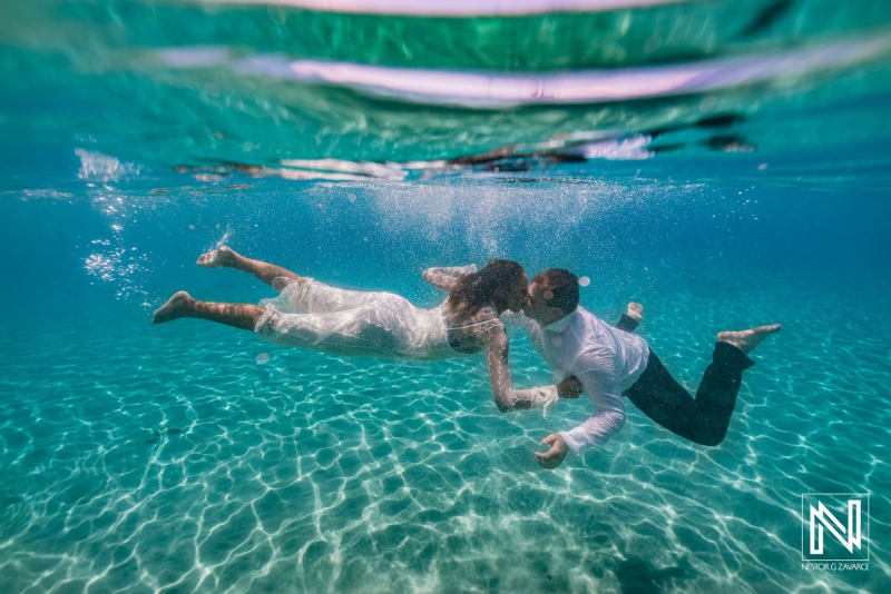 Couple shares a kiss underwater in Curacao during their wedding celebration