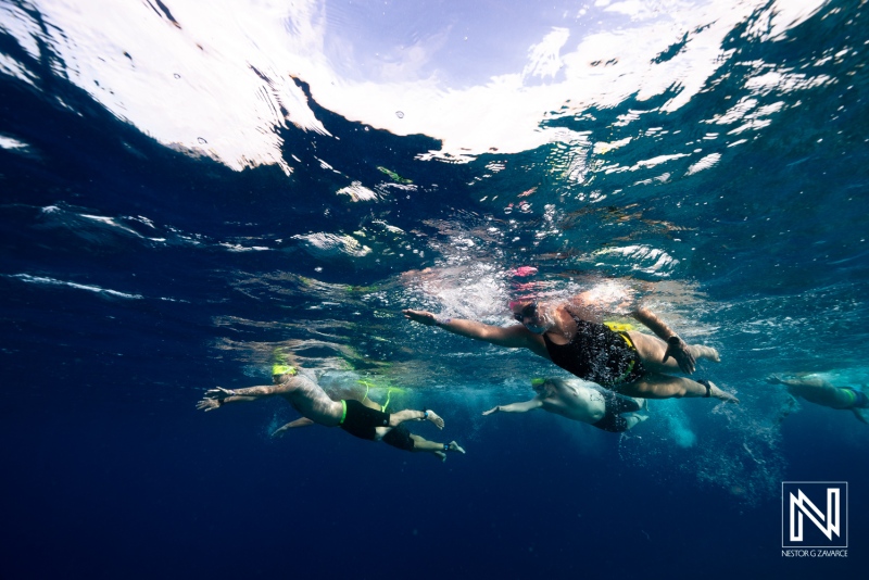Underwater exploration in Curacao with swimmers enjoying the clear waters and marine life