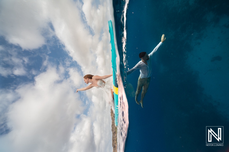 Trash the dress session in Curacao with a couple underwater and above water