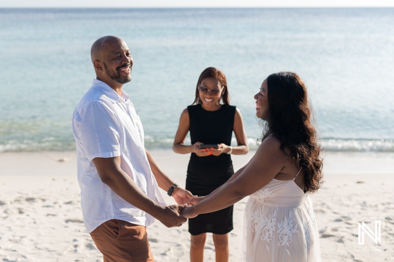 Couples vow renewal ceremony on the beach in Curacao with a pregnancy reveal celebration taking place during sunset