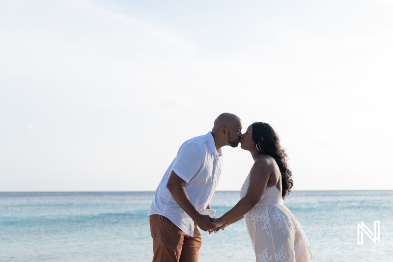 Couple embraces romantic vow renewal on the beach in Curacao while revealing pregnancy news