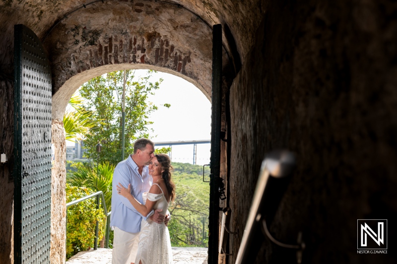 Couple shares vows at a romantic renewal ceremony in scenic Curacao under the bright Caribbean sun