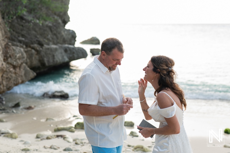 Couple celebrates vow renewal on the beautiful beaches of Curacao under soft sunlight by the shore