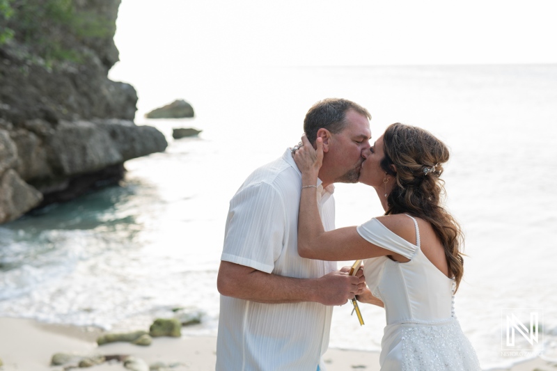 Vow renewal ceremony on the serene beaches of Curacao under a soft sunset glow