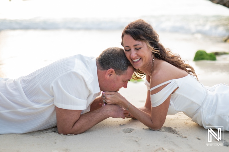 Couple enjoys a heartfelt vow renewal ceremony on the serene beaches of Curacao during sunset