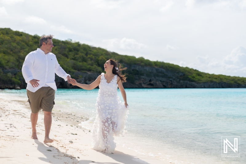 Couple joyfully celebrates vow renewal at Cas Abao Beach in Curacao with stunning ocean backdrop