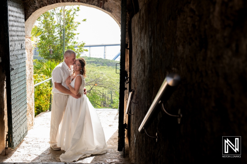 Couple celebrating vow renewal ceremony in picturesque Curacao with scenic views in the background