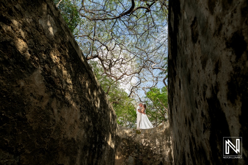 Couple celebrates vow renewal in serene outdoor setting in Curacao under vibrant sky
