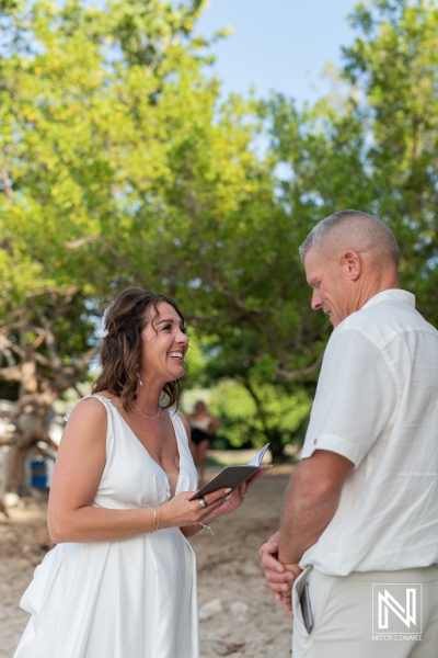 Couple celebrates vow renewal in beautiful Curacao with smiles and love under a sunny sky surrounded by nature