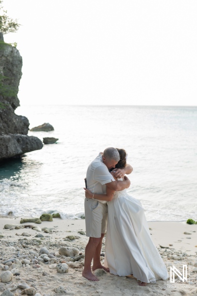 Couple celebrates vow renewal on the beautiful shores of Curacao during a serene sunset