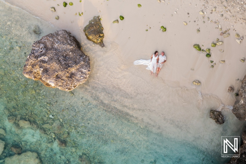 Couple renewing vows on the serene beaches of Curacao during a beautiful sunny day