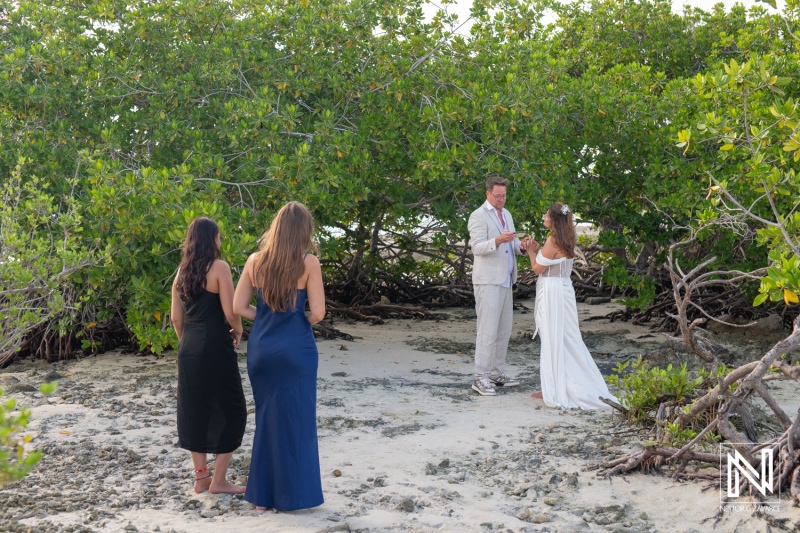 Vow renewal ceremony with friends at Doggy Beach in Curacao during a sunny afternoon