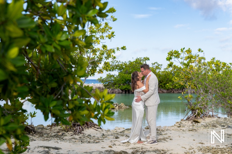 Vow renewal ceremony at Doggy Beach in Curacao with scenic tropical backdrop