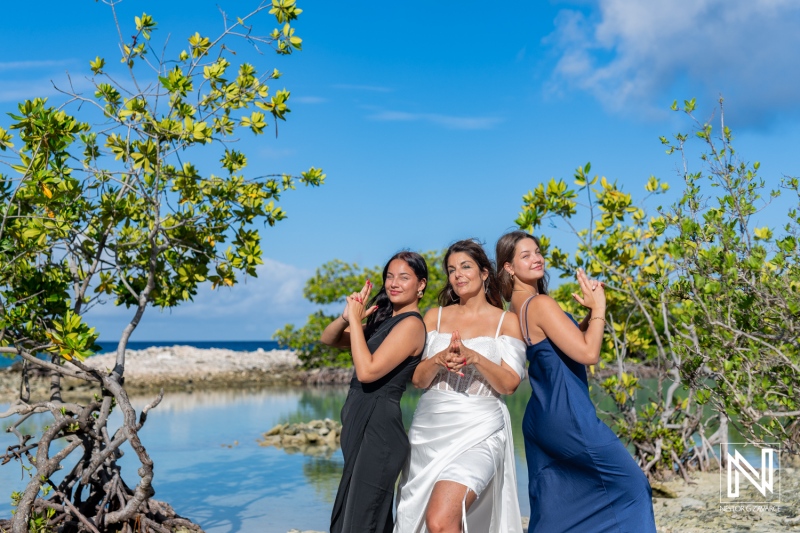 Vow renewal ceremony at Doggy Beach in Curacao with joyful celebration among friends by the sea