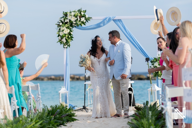 Bride and groom walking down the aisle