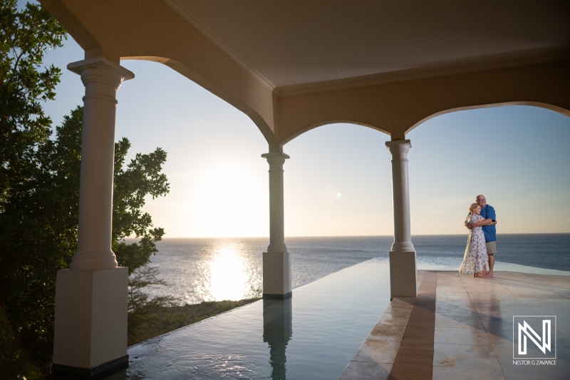 A Couple Enjoys a Romantic Sunset Beside the Tranquil Ocean at a Luxurious Villa, Creating Lasting Memories During Their Getaway in a Picturesque Location