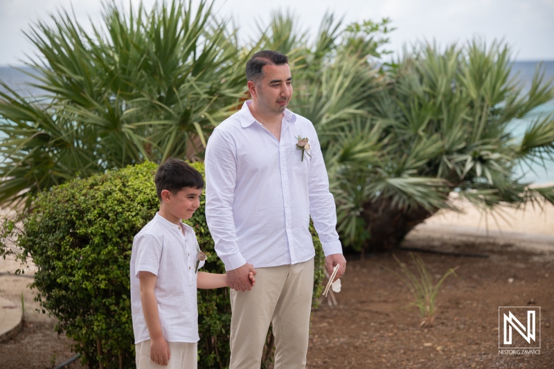 Vow renewal ceremony at Curacao Marriott Beach Resort with father and son