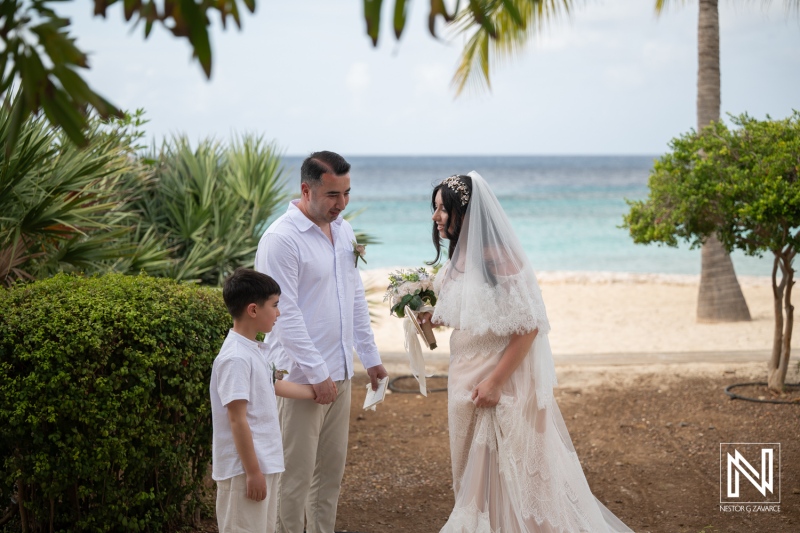 Couple renews vows at Curacao Marriott Beach Resort on a sunny day by the ocean