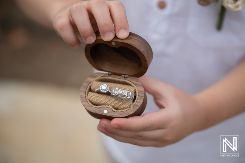 Vow renewal ceremony at Curacao Marriott Beach Resort with rings in wooden box